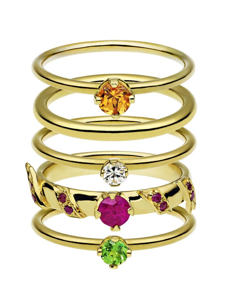 Ana de Costa stacking rings in yellow gold set with, top to bottom, a mandarin garnet, diamond, rubies and a tsavorite. From the Alchemy collection.